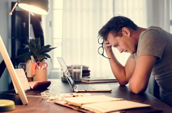 man stressed while working on laptop GDPR - RGPD