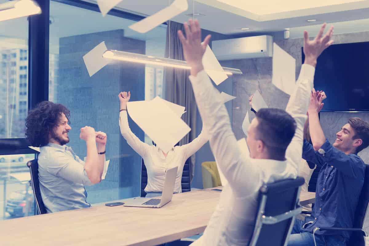 startup group of young business people throwing PQMZSAP 1